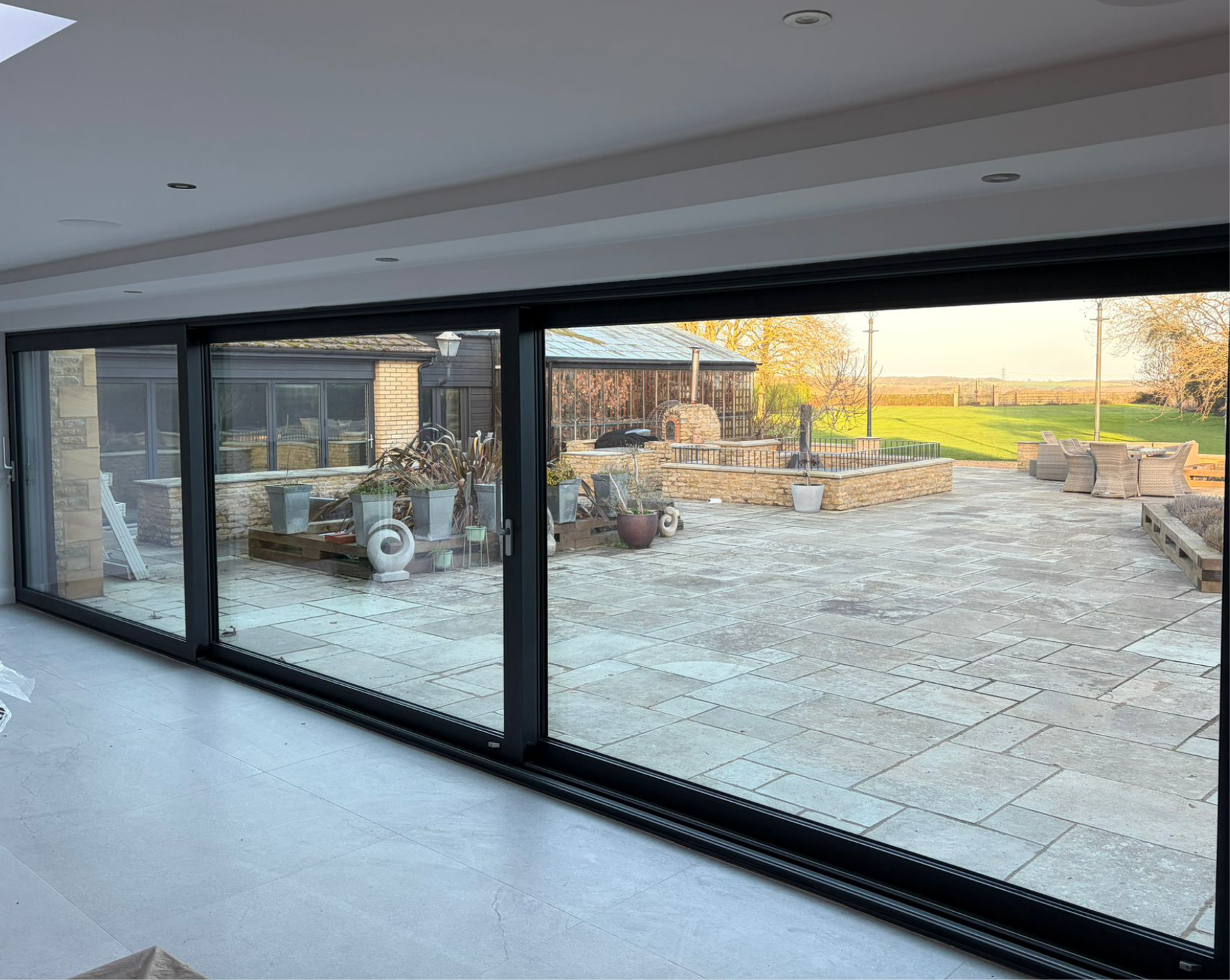 Interior threshold detail of aluminium sliding patio doors in a Wansford home