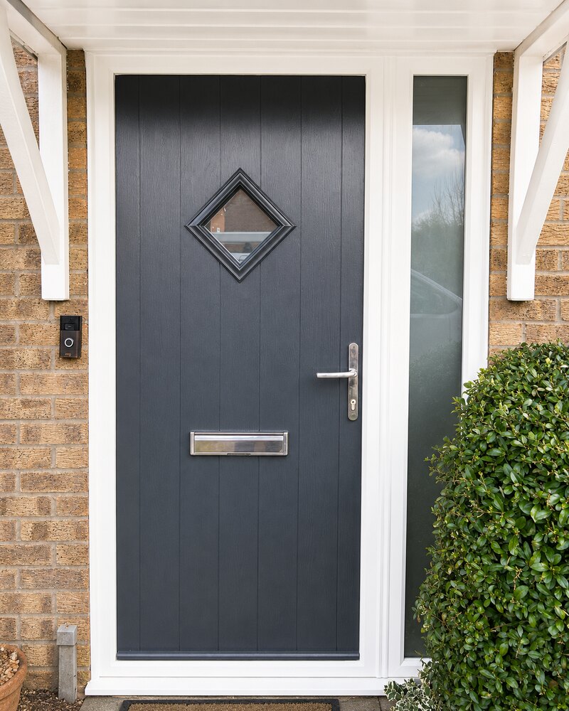 Anthracite grey composite door with diamond glazing and side panel on a Cambridgeshire home