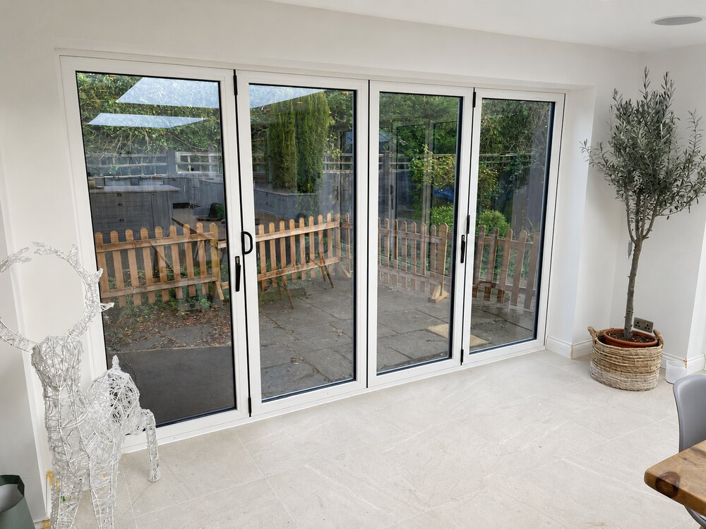 White aluminium bi-fold doors interior view in Cambridgeshire