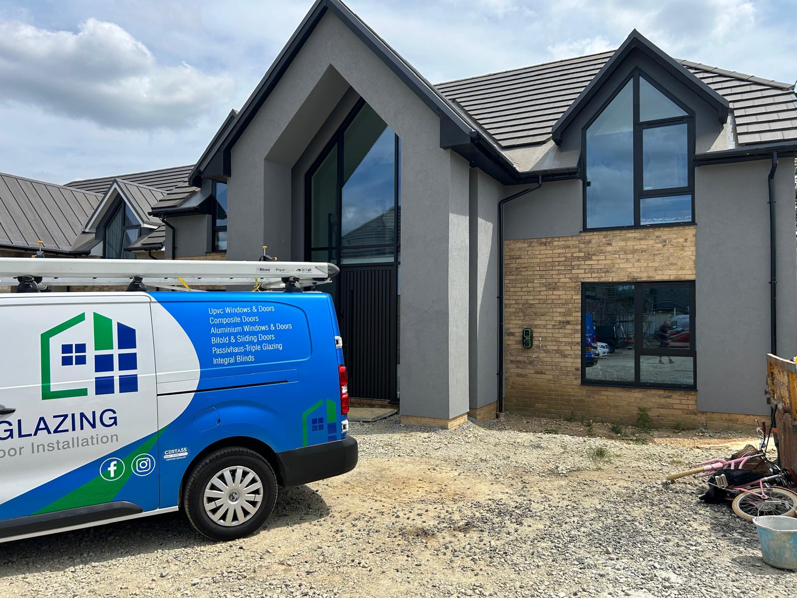New build house with anthracite aluminium windows and apex gable glazing installed by AJ Glass and Glazing in Rutland